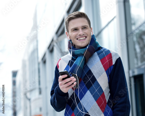 Guy enjoying music on street