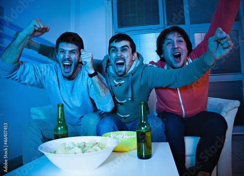 Friends watching sports on TV