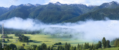 Alpine valley in the morning mist