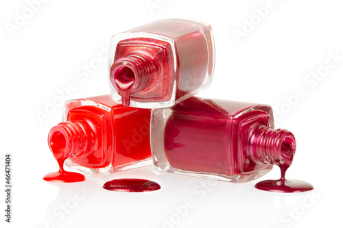 Red nail polish spilled on white background, clipping path