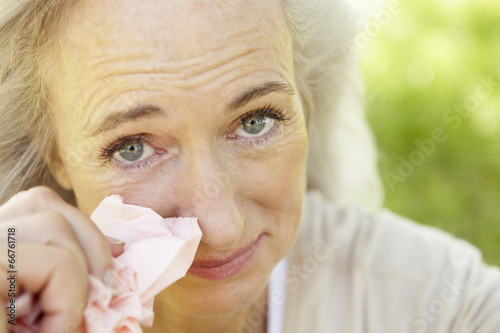 Senior woman with hay fever