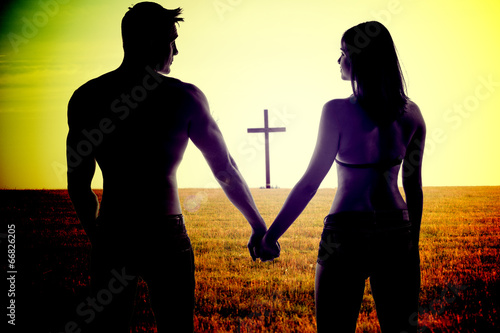 Romantic young couple holding hands