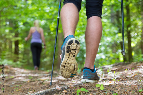 Young couple hiking in nature. Sport and exercise.