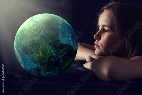 Teen girl with planet earth.