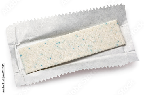 Chewing gum plate on wrapping paper isolated on white