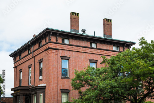 Old Brick Building with Two Chimneys