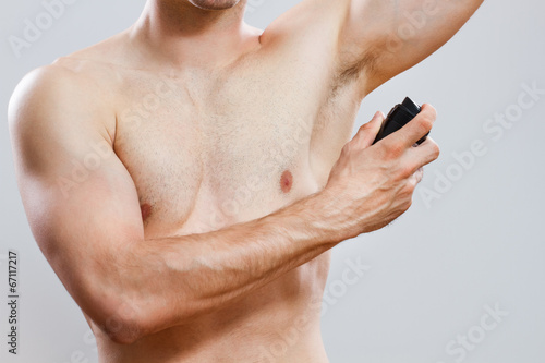 Man using deodorant