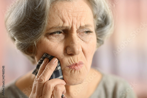 Close-up of ill elderly woman