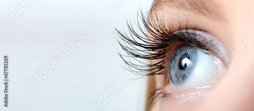 Female eye with long eyelashes close-up