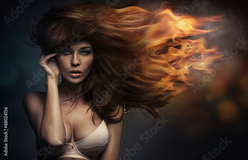 Art portrait of the woman with the flame hairstyle
