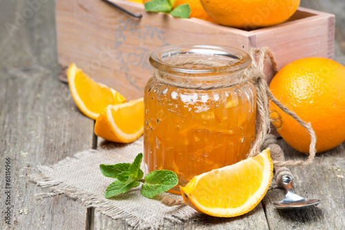 orange marmalade in a glass jar, horizontal