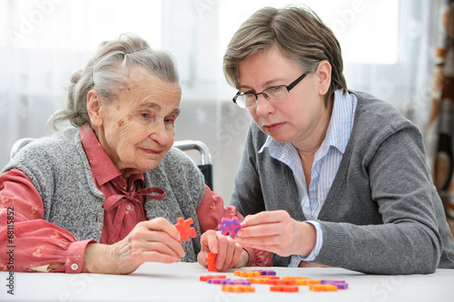 Senior woman with her elder care nurse