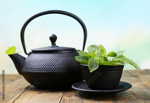 Chinese traditional teapot with fresh mint leaves