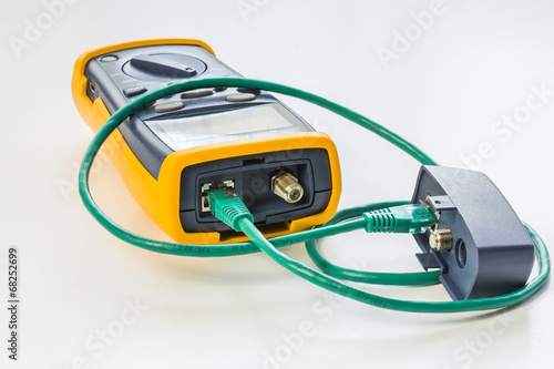 network tester with green RJ45 cable 5e connected for testing