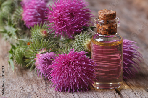 Oil of burdock close-up on a table