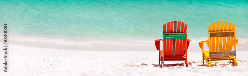 Colorful chairs on Caribbean beach