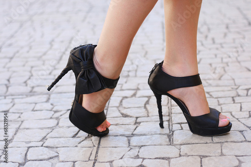 woman legs in high heel shoes outdoor shot