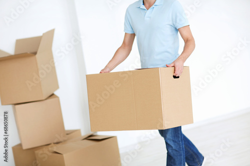Man with a box indoors