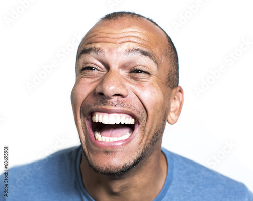 Portrait of a mixed race man laughing hysterically