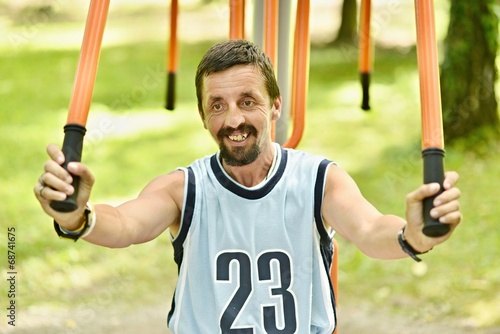 Man exercising in a public park