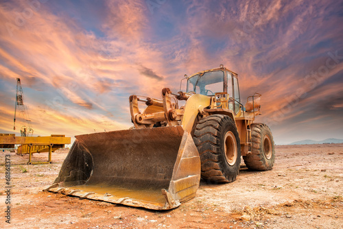 excavator loader machine during earthmoving works outdoors