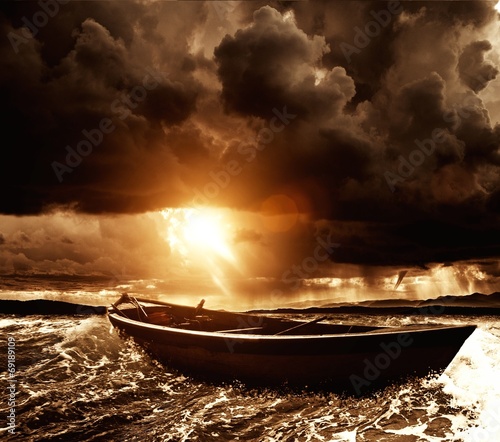 Wooden boat in a stormy sea