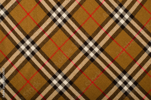 Tartan pattern.Brown plaid print as background.Asymmetric square