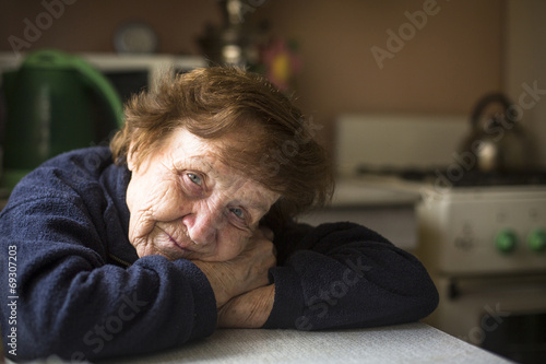Portrait of an elderly woman in her home. Close-up.
