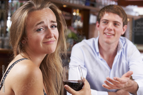 Couple On Unsuccessful Blind Date In Restaurant