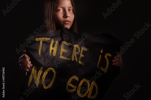 Atheist teen girl holding a banner with the inscription