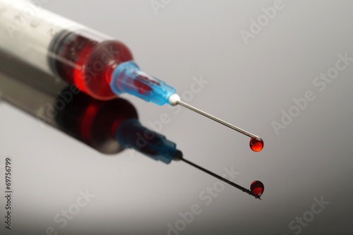 Syringe with red drop