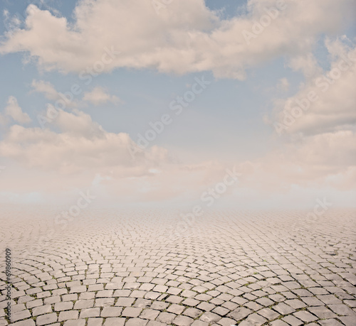 cobblestone background with sky on sunset