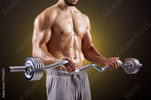 Fitness man lifting weights with curl bar