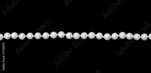 Single thread of faux pearls