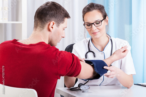 Doctor measuring blood pressure