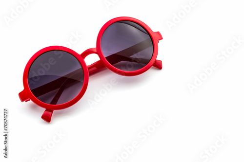 Stylish red sunglasses .