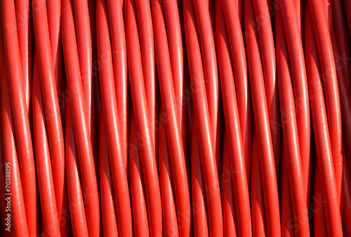 background of red electric cable insulating rubber