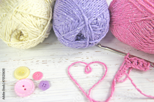 Yarn Wool pastel colours with crochet hook heart and buttons