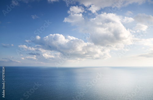 Blue sky with clouds over sea