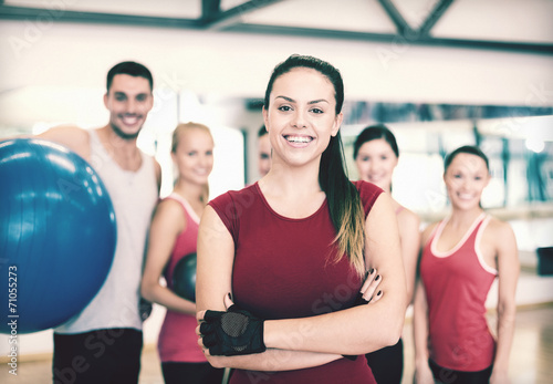 woman standing in front of the group in gym