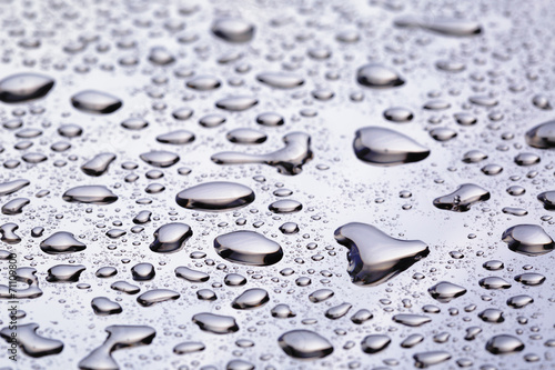 abstract water drops on polished stainless steel surface