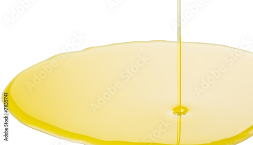 Pouring olive oil on white surface