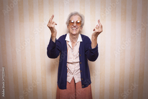 cool elder lady making middle finger sign