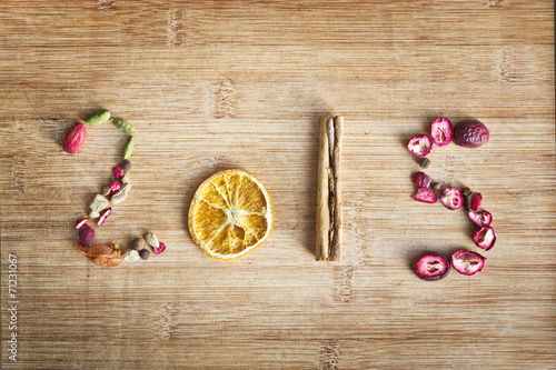 2015 written with spices on wooden background