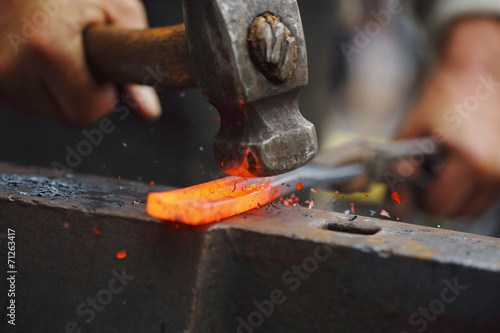 Forging hot iron