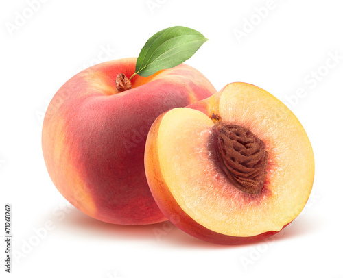 Beautiful whole peach and split isolated on white