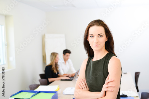 young woman executive manager in meeting room with staff