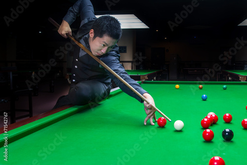 Handsome man playing snooker