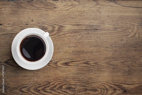 Black coffee cup on old wooden table top view
