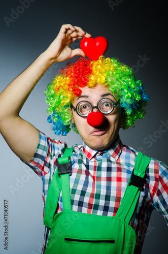 Clown with red heart in romantic concept